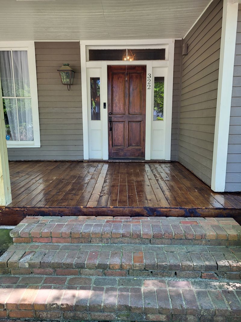 Porch front with wood siding and door
