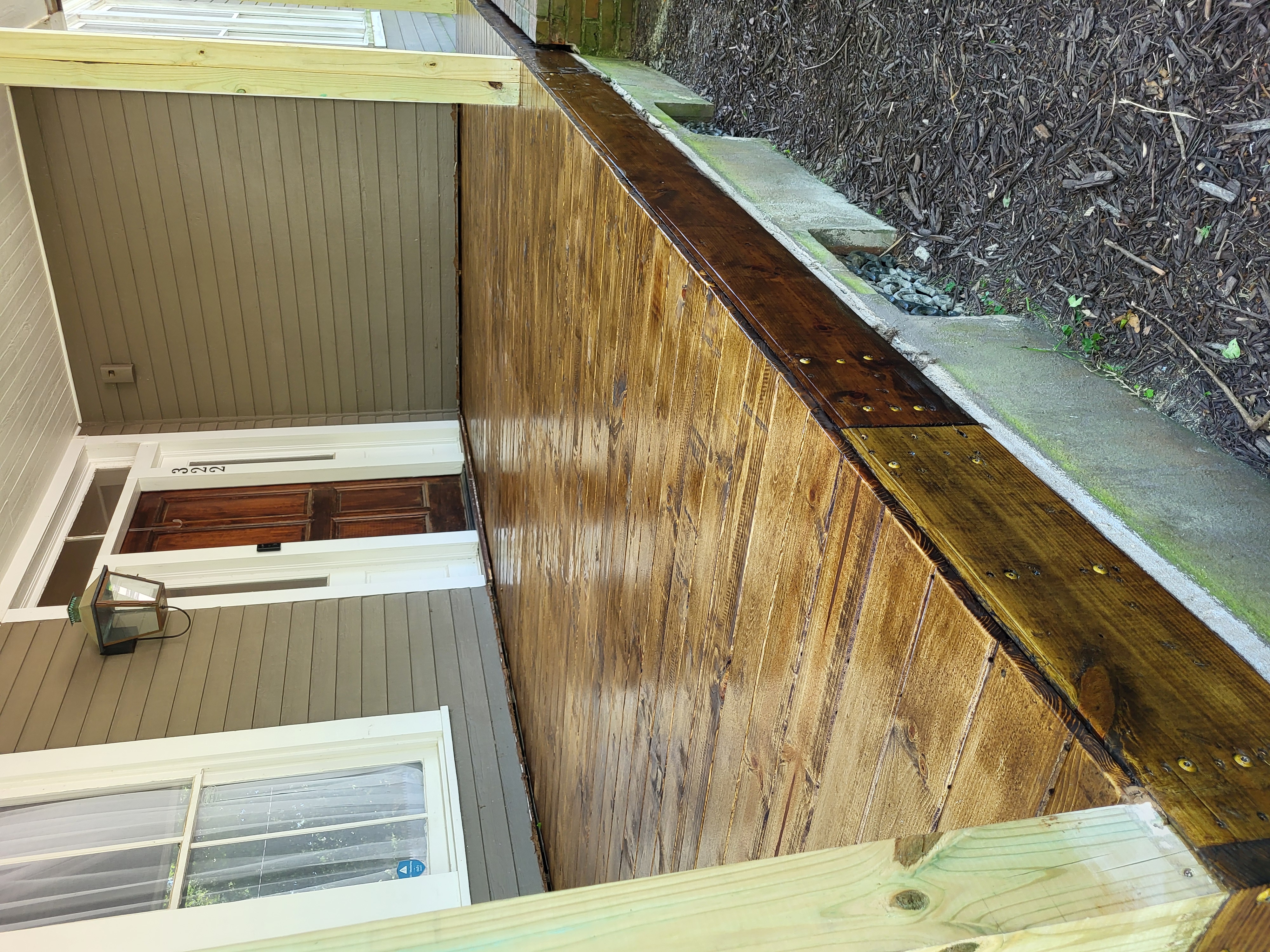 Porch side view with natural wood finish